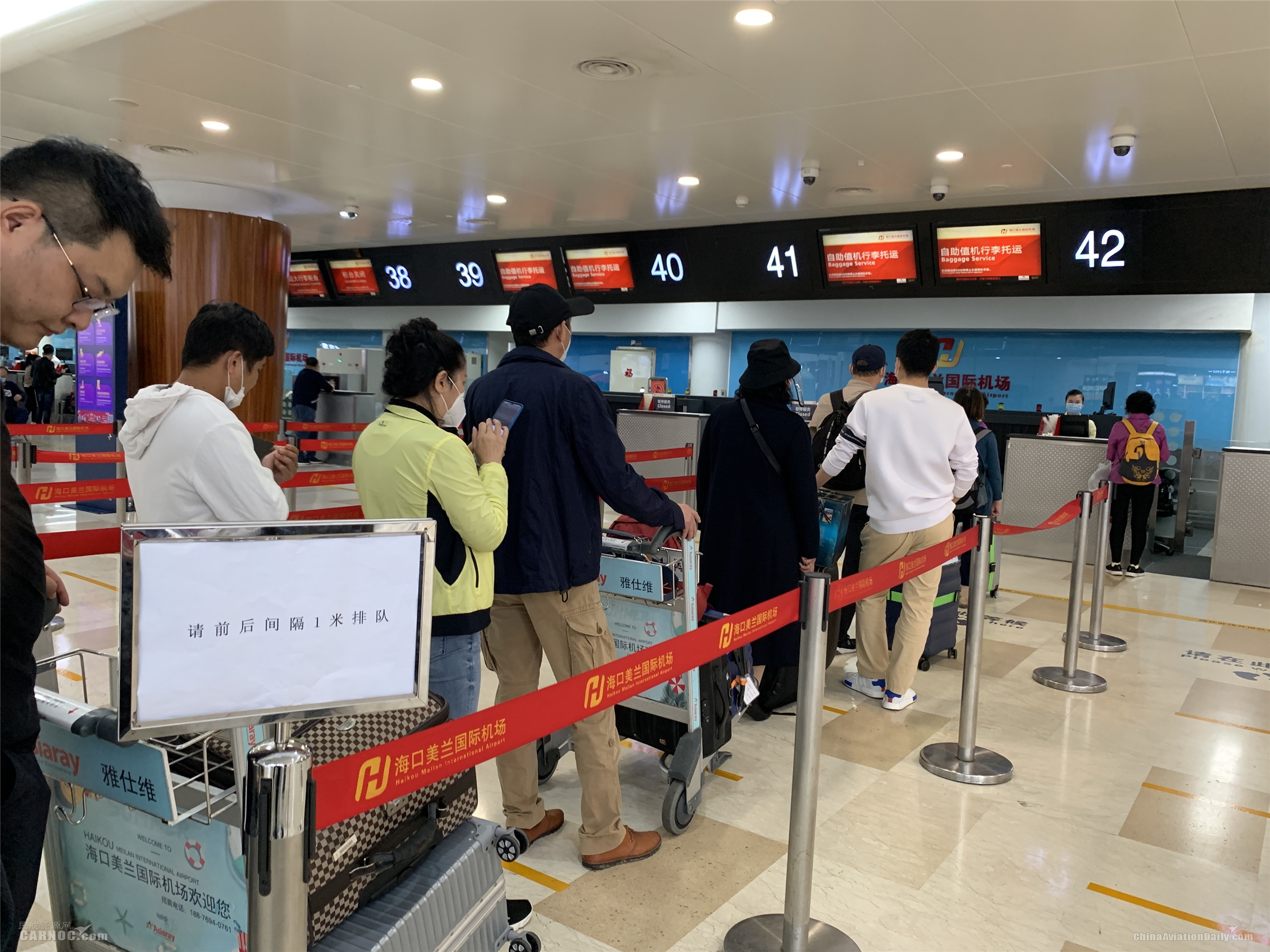 商品編碼查詢-氣溫攀升 客流回暖 海口美蘭國際機場戰(zhàn)“疫”復(fù)工兩手抓（附圖）